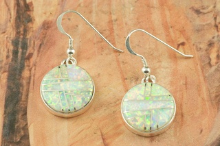 Stunning Fire and Ice Lab Opals inlaid between ribbons of Sterling Silver. Beautiful Sterling Silver French Wire Earrings feature precision channel inlay. Designed by Navajo Artist Calvin Begay. Signed.